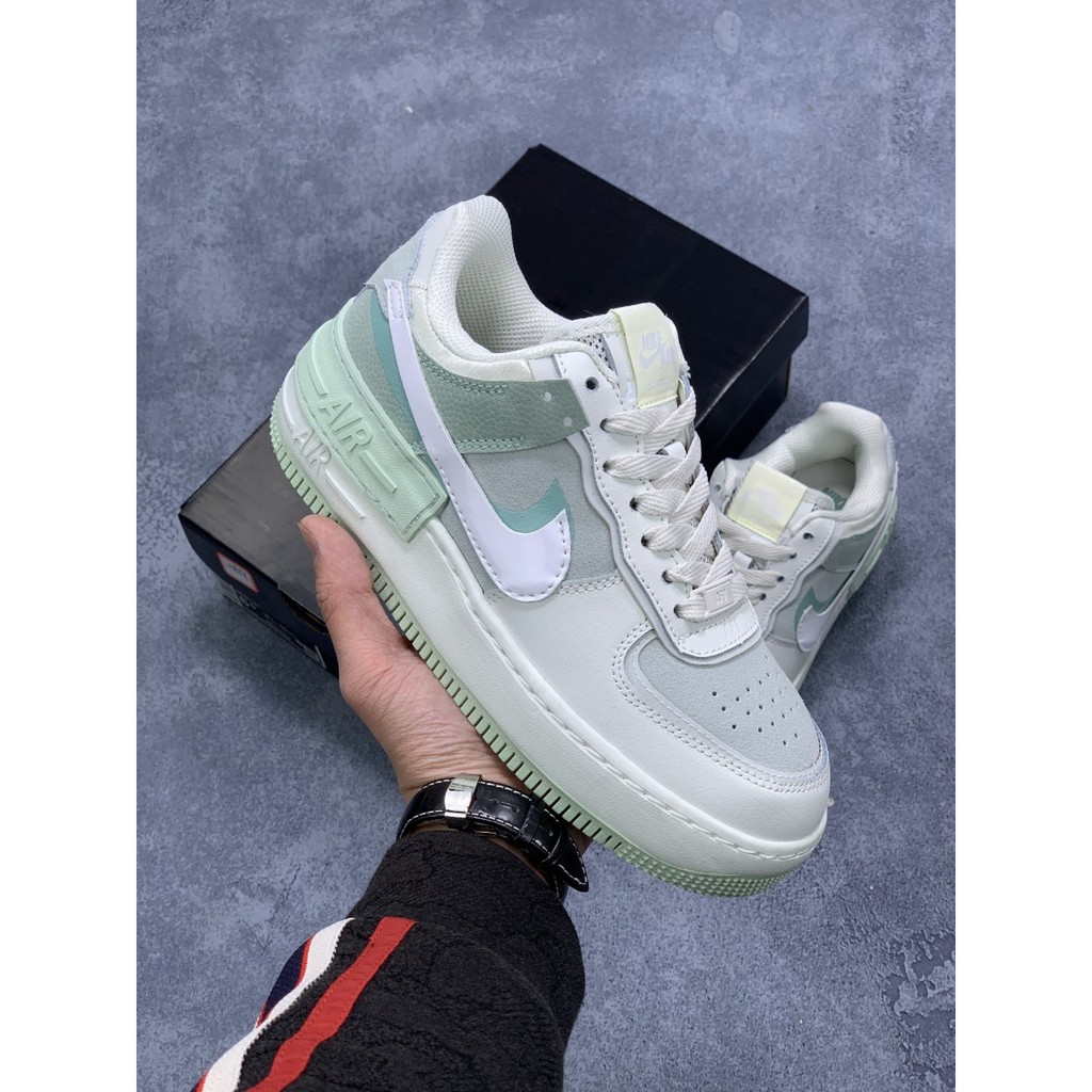 gray and green air force ones