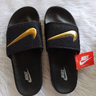 gold check nike slides