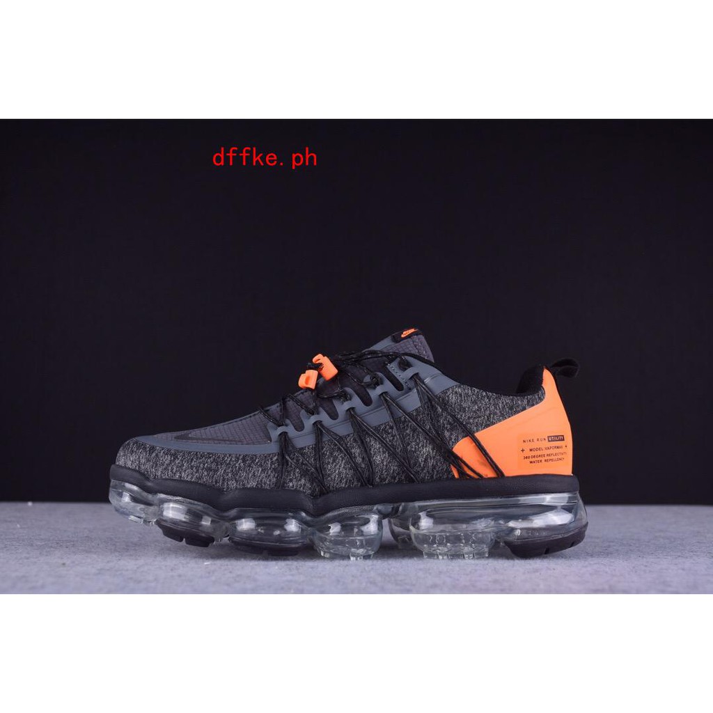 gray and orange vapormax