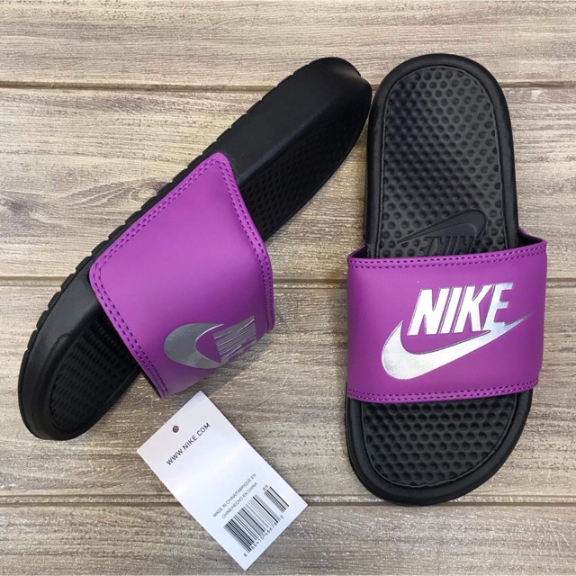 purple nike benassi slides