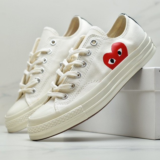 white sneakers with heart on side