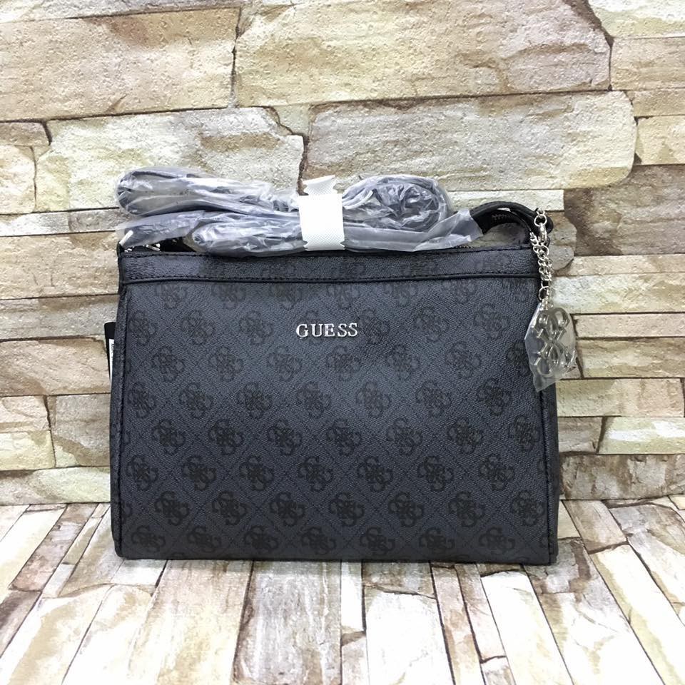 Guess Sling Bag with keychain |
