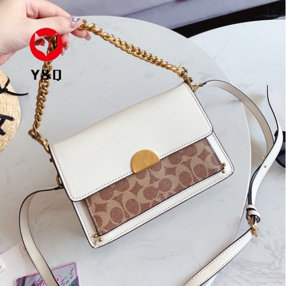 white crossbody bag coach