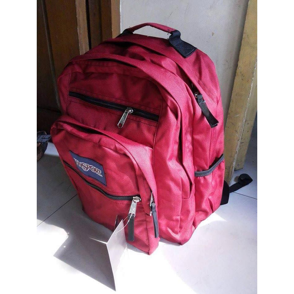 red jansport big student backpack