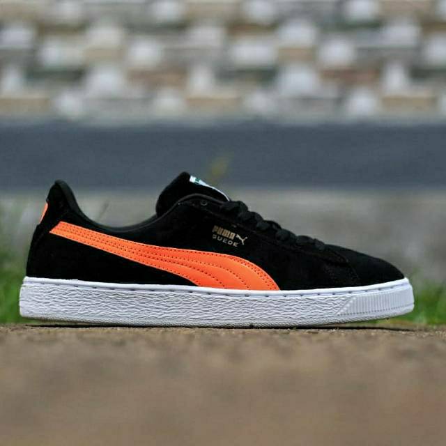 puma orange and black shoes
