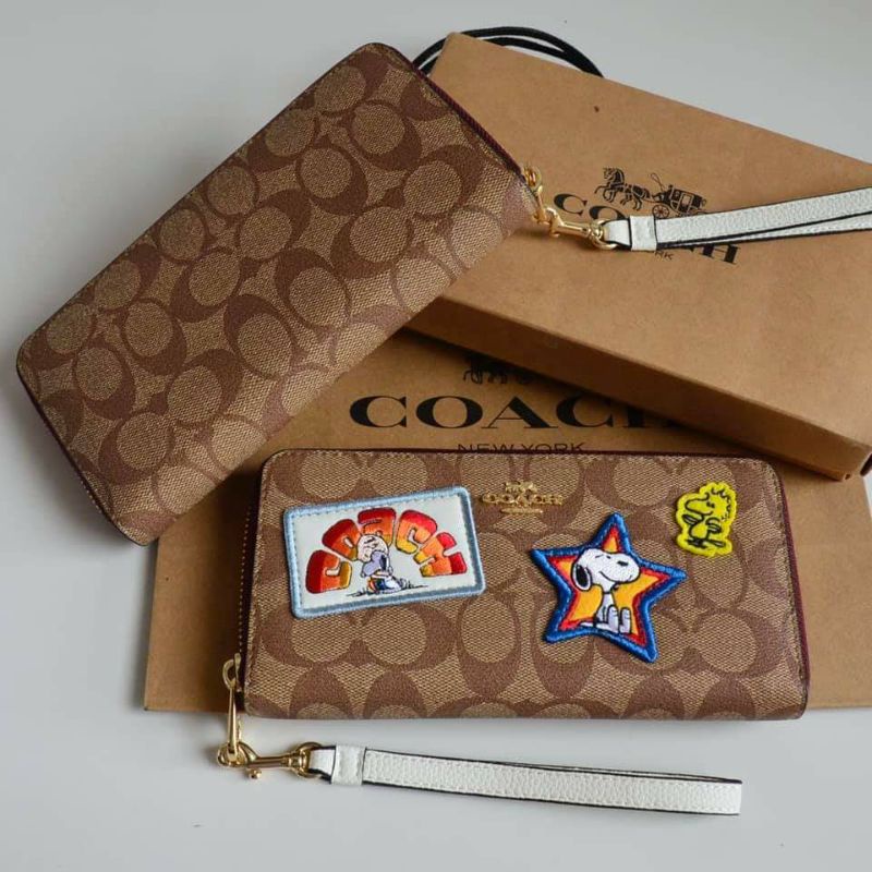 COACH X PEANUTS LONG ZIP AROUND WALLET IN SIGNATURE CANVAS WITH VARSITY