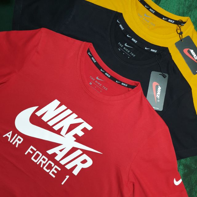 red black and yellow nike shirt