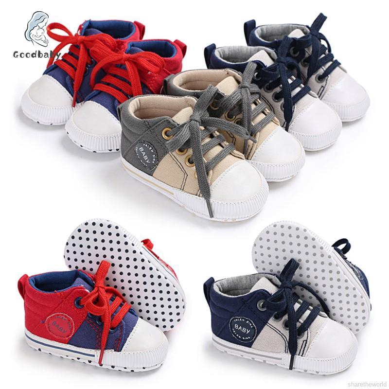 white canvas baby shoes