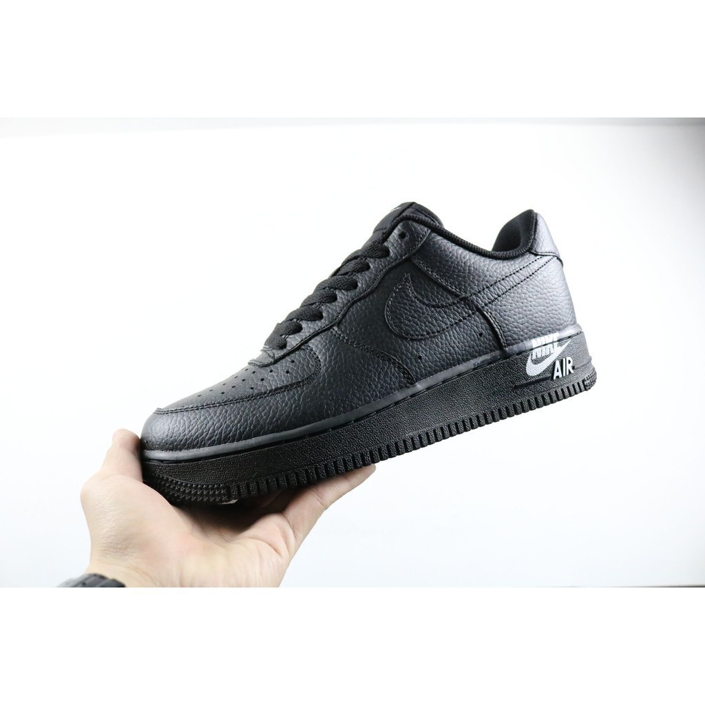 white sneakers with black heel