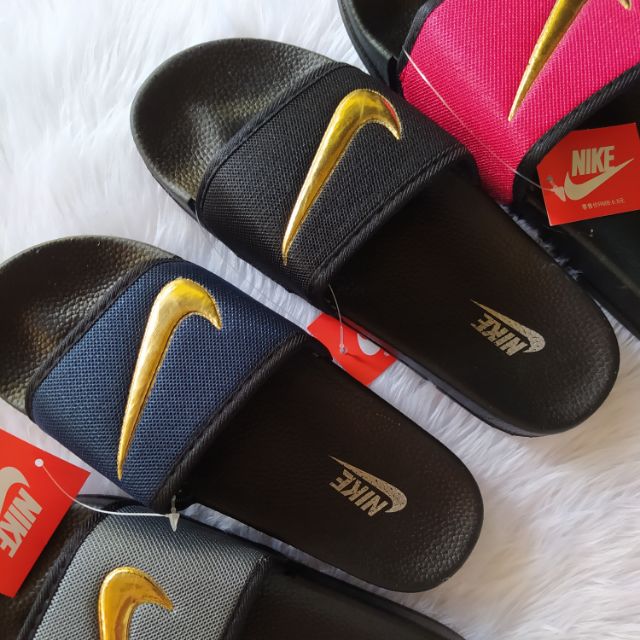 gold check nike slides