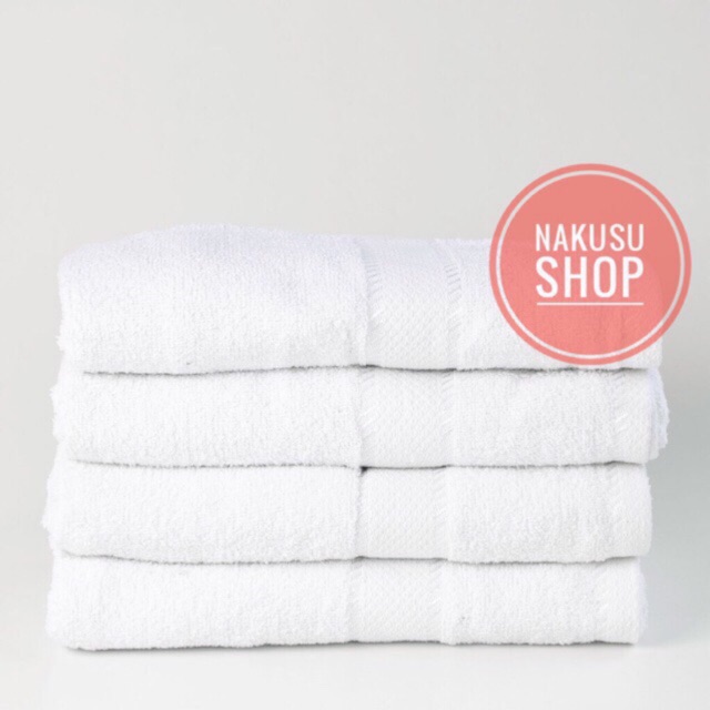 white cotton bath towels