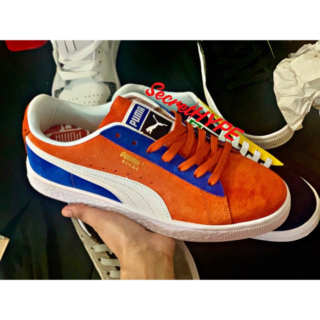 puma orange and white shoes