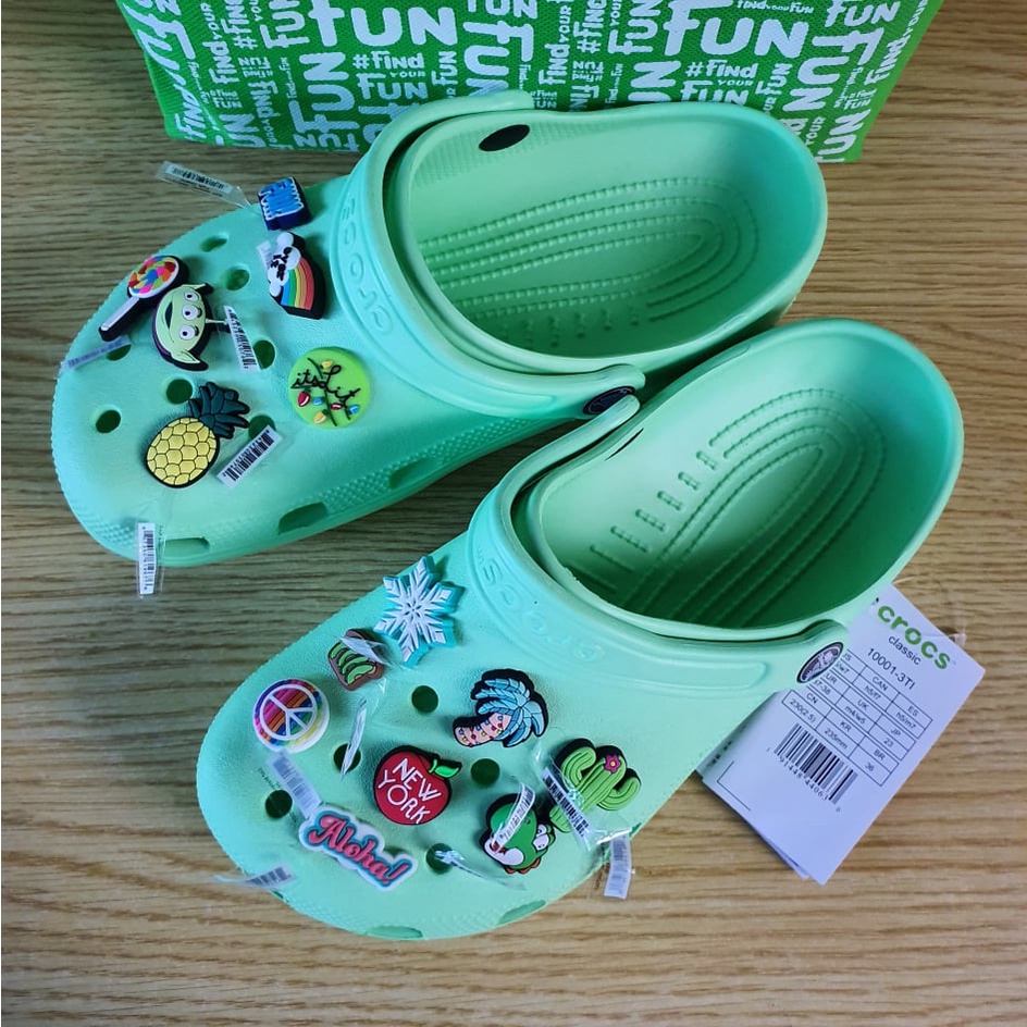 mint green crocs with jibbitz