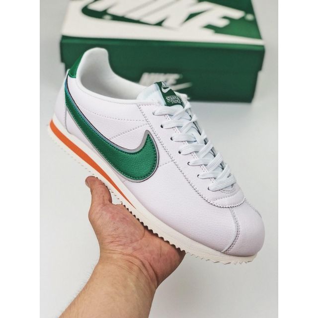 white and green nike cortez