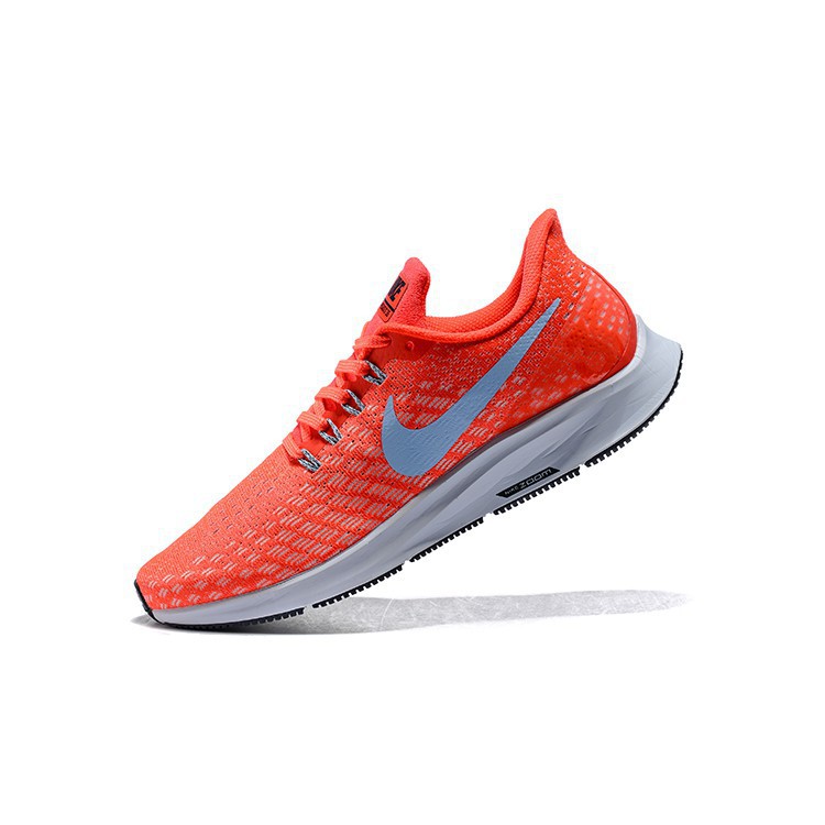 orange and white nike shoes