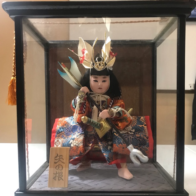 japanese doll in glass case