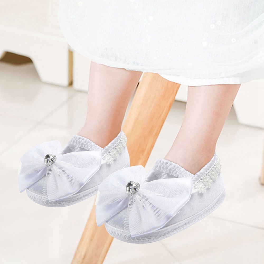 white satin baby shoes