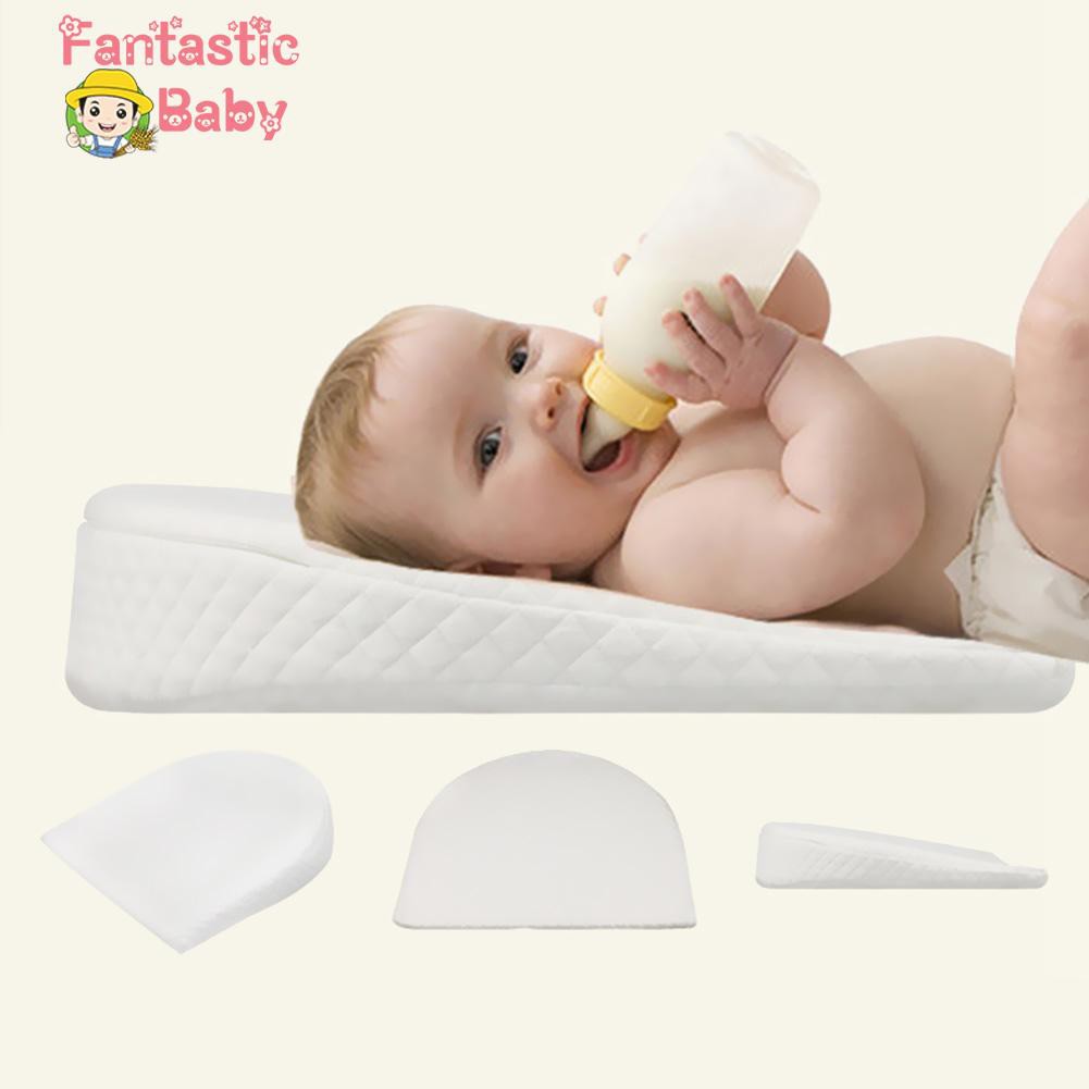 baby sleeping in nursing pillow