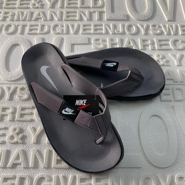 buy nike slippers at 50 off