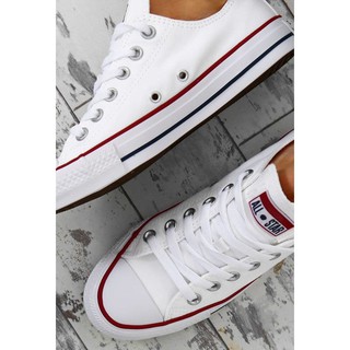 men wearing white converse