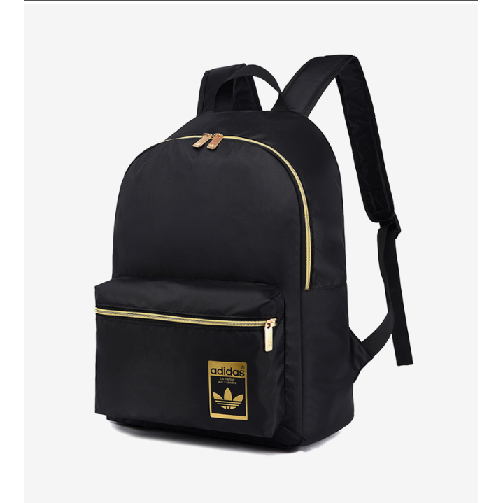 gold and black adidas bag