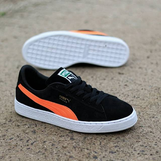 puma orange and black shoes