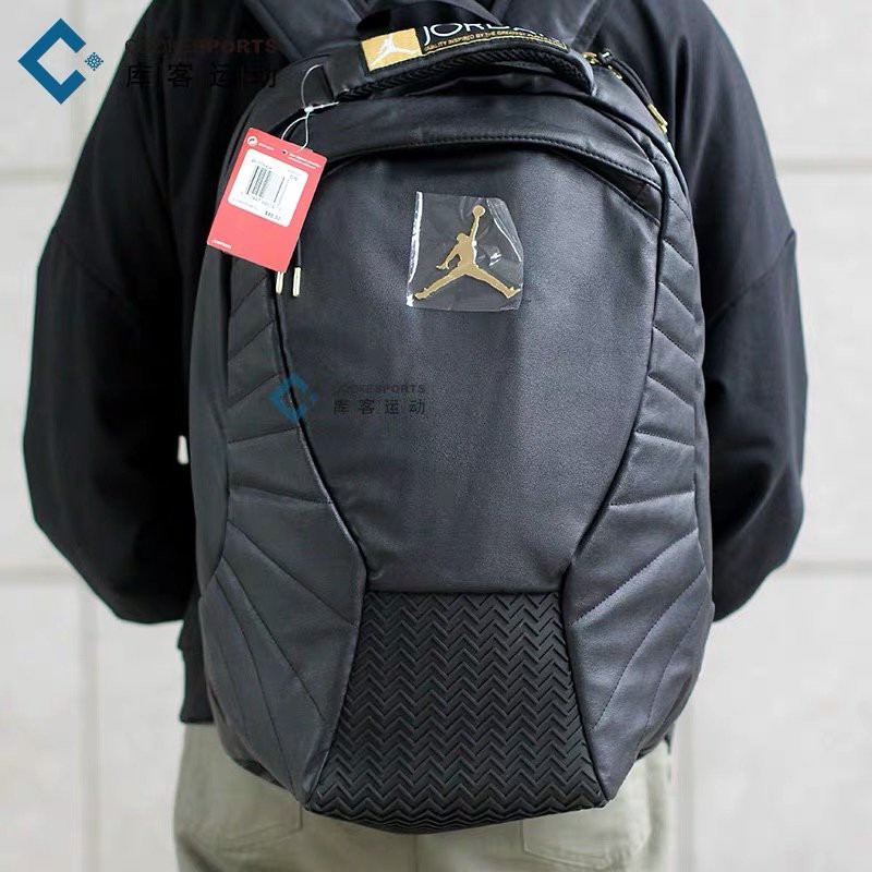gold and black jordan backpack