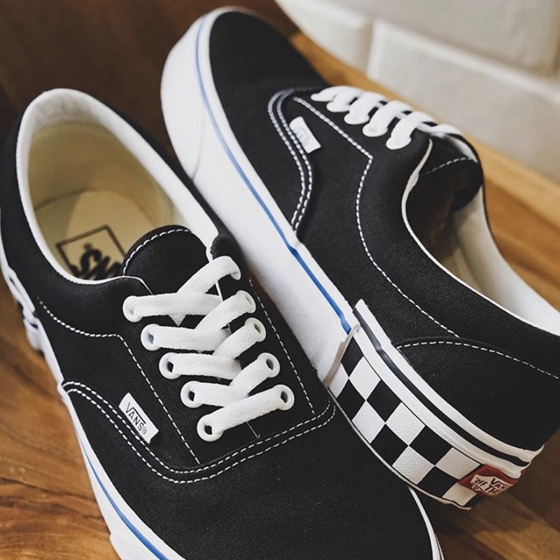 red and black low top vans