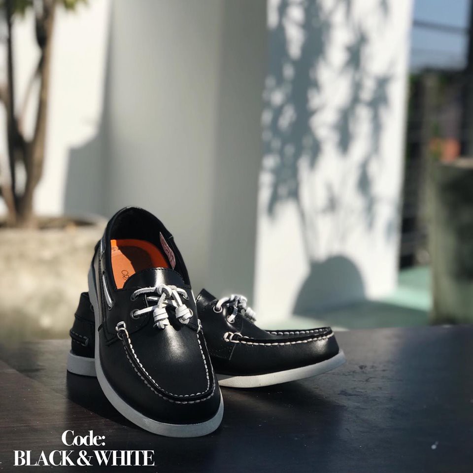 black and white boat shoes