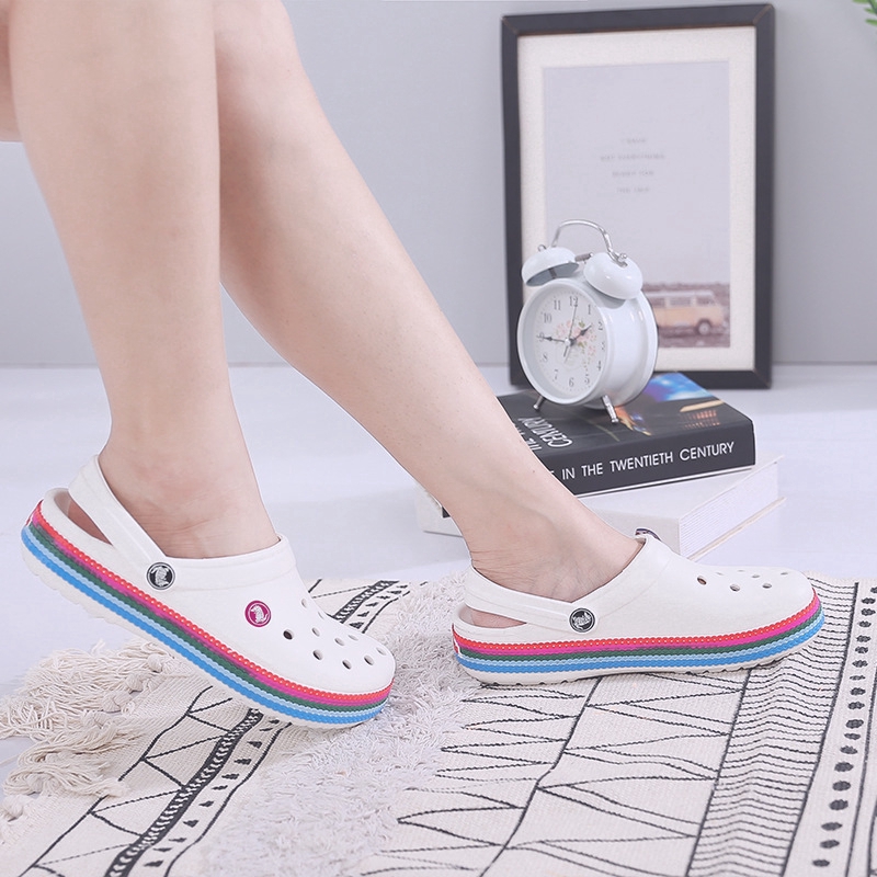 white crocs with rainbow words