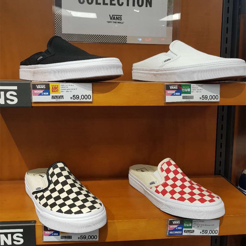 half black half white slip on vans