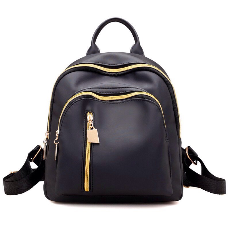 black backpack with gold zippers