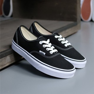 white and black authentic vans