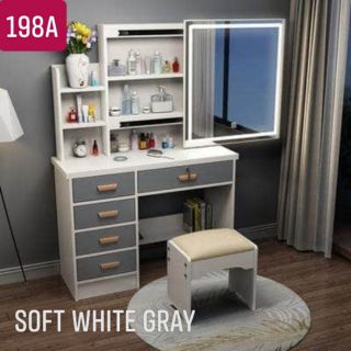 white desk with mirror and lights