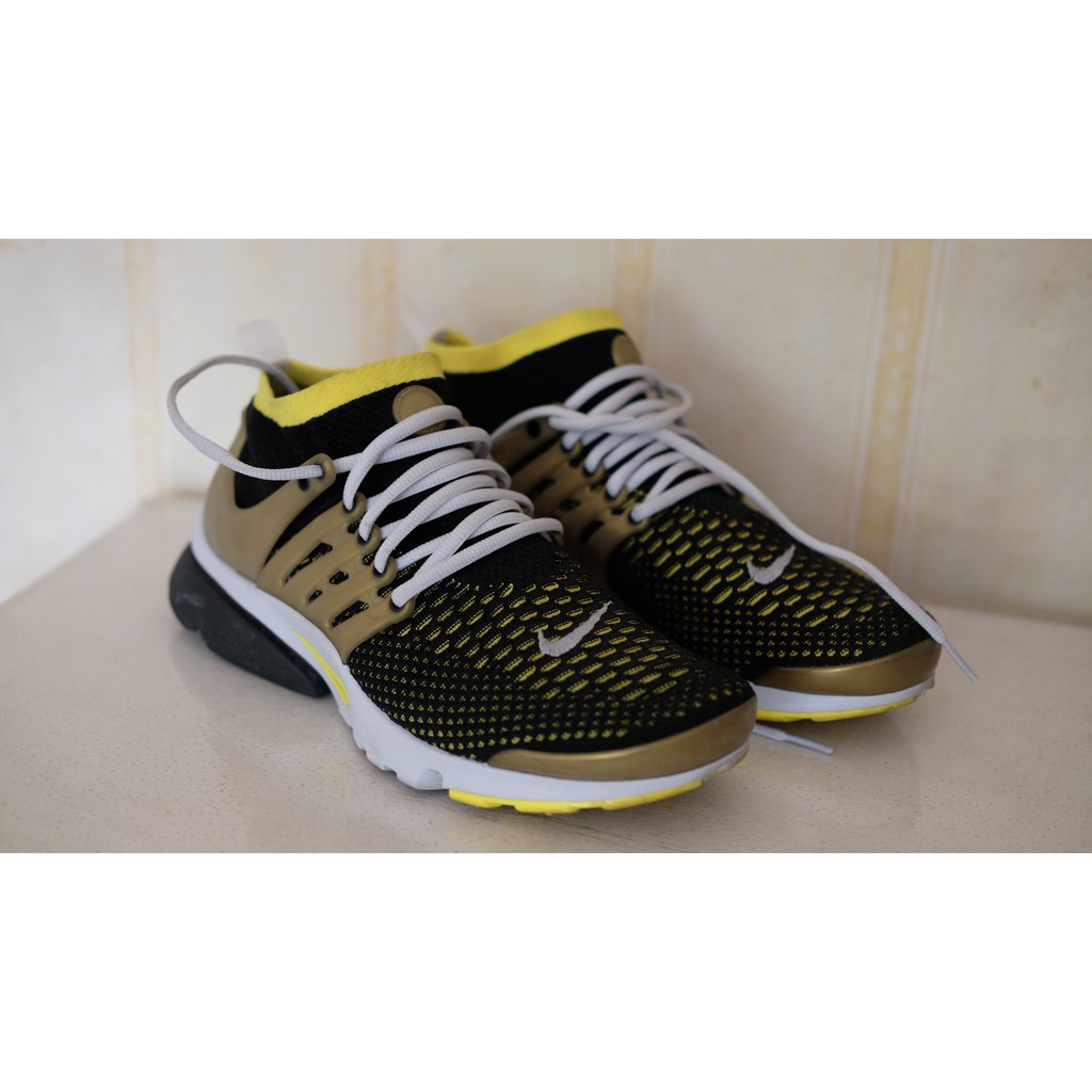 nike flyknit ultra black and gold