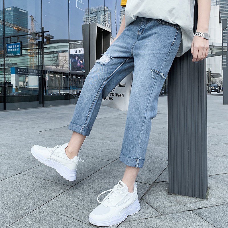 light blue cut jeans