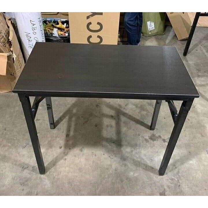 black fold up table and chairs