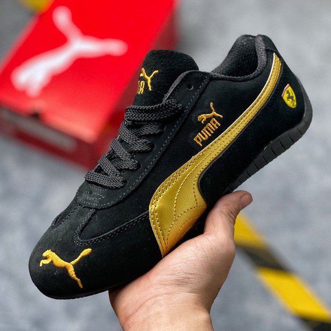 puma black gold shoes