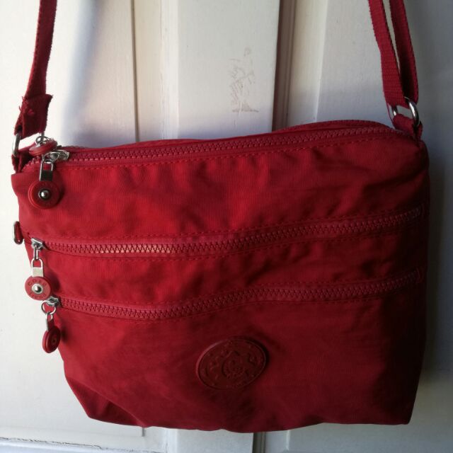 red sling bag