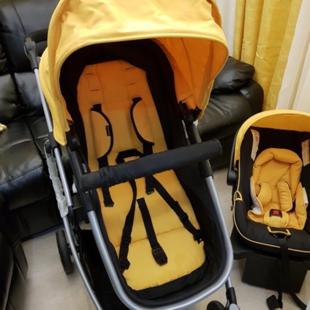 yellow car seat and stroller