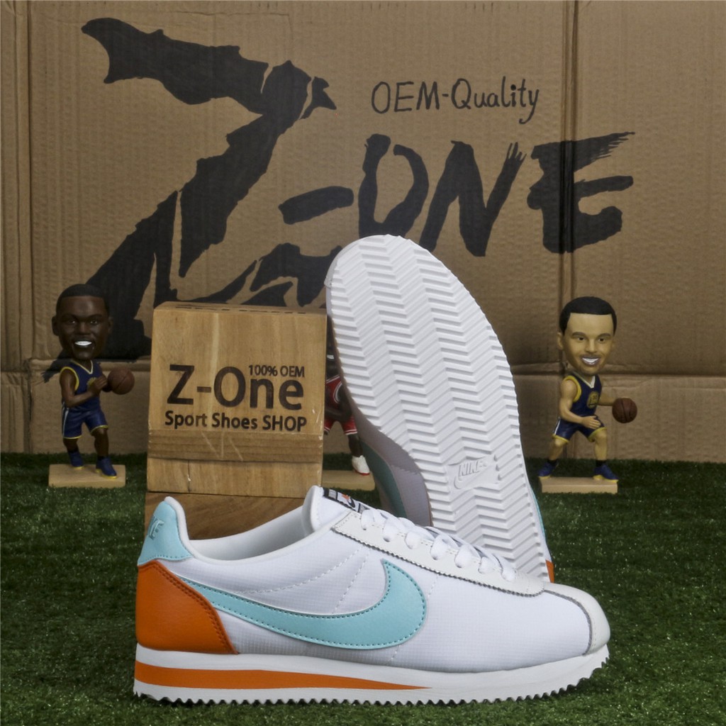 orange and white nike cortez