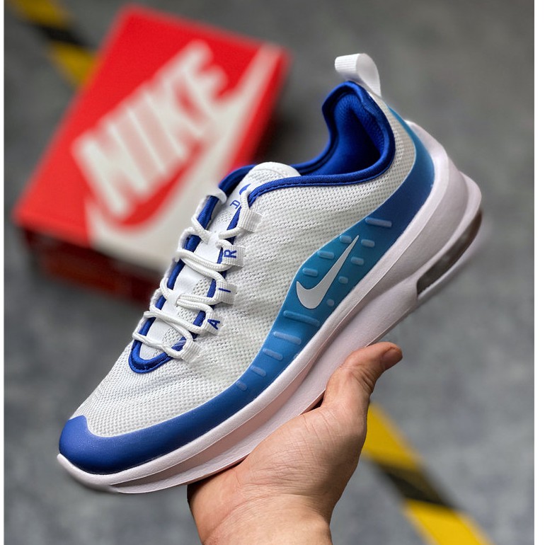 white and blue nike running shoes