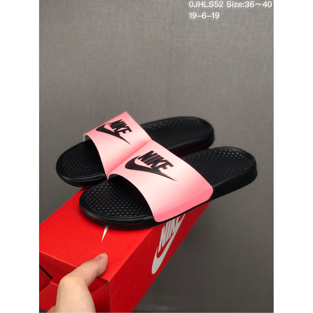 pink and black nike flip flops