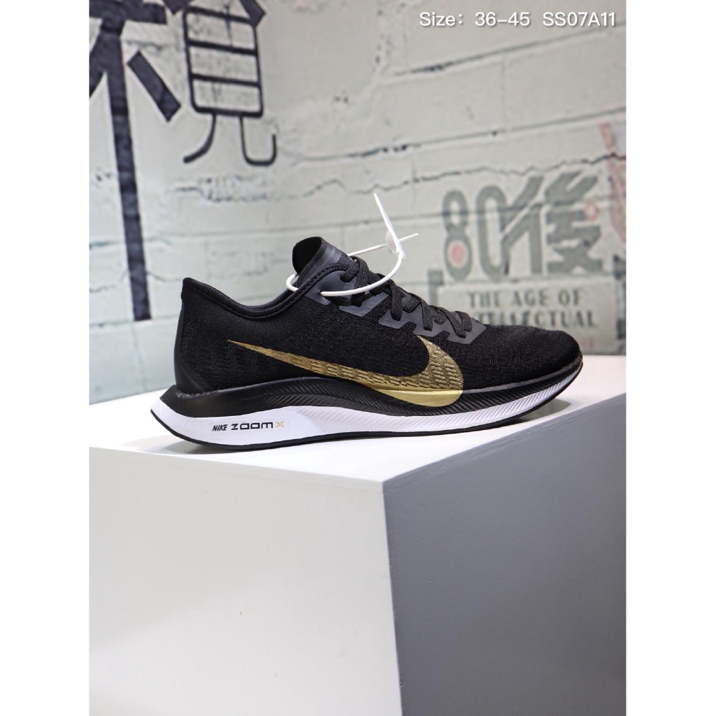 black and gold nike runners