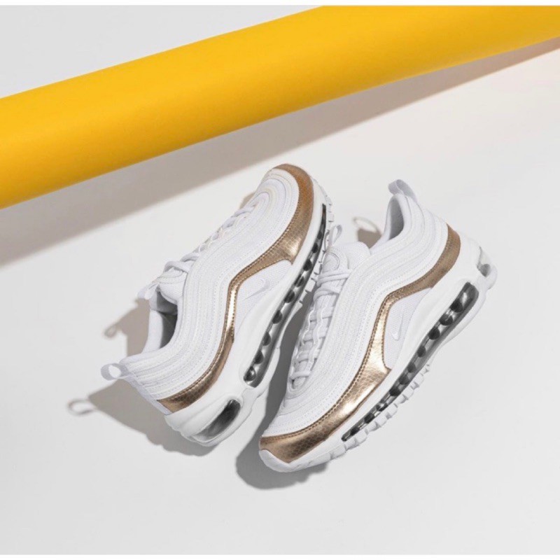 white and rose gold nike shoes