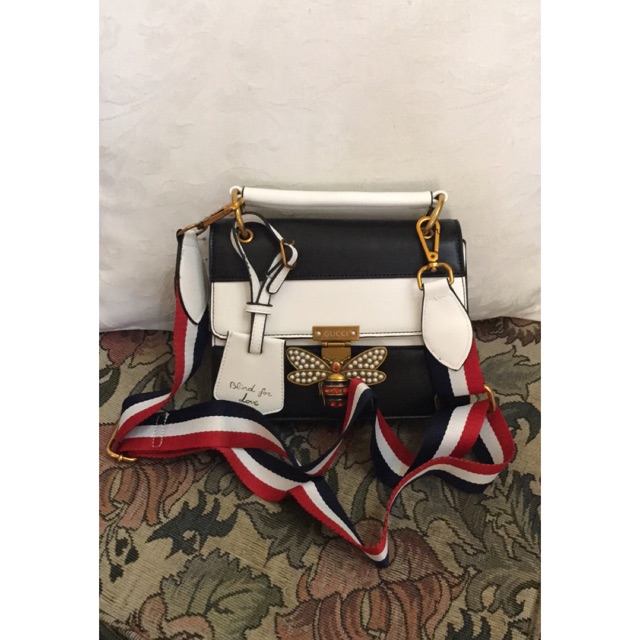 gucci bag with butterfly buckle