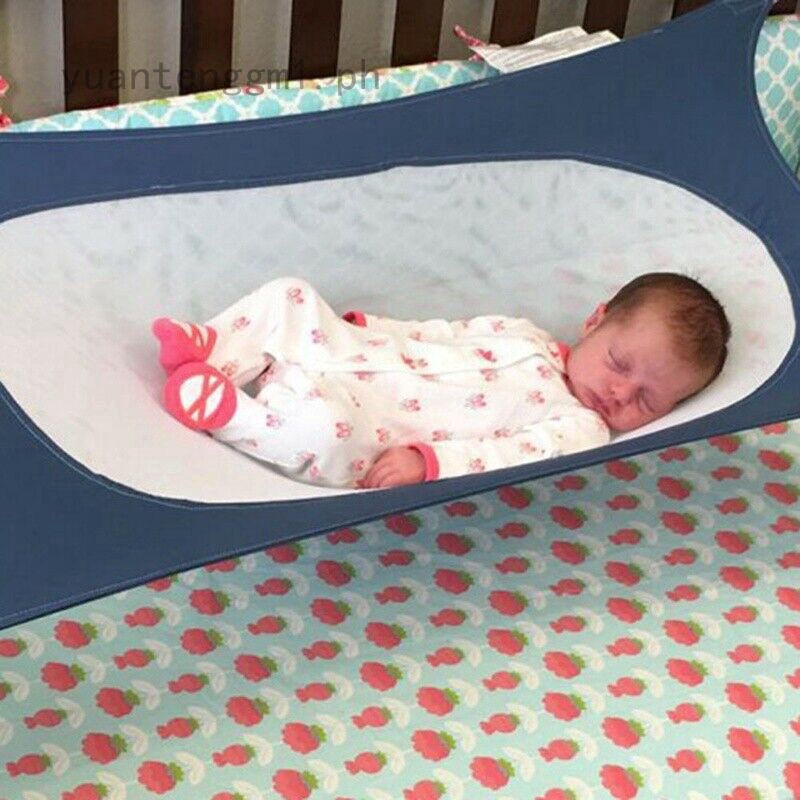 baby sleeping in playpen