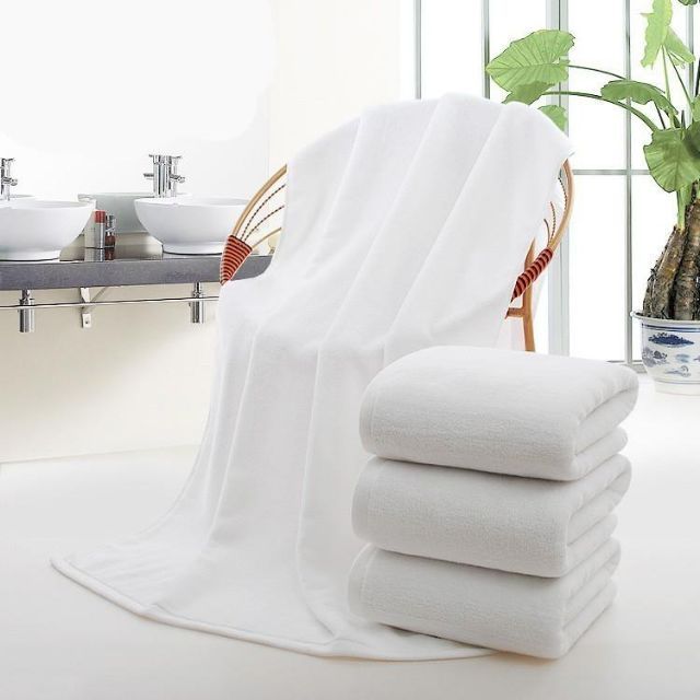 white cotton bath towels