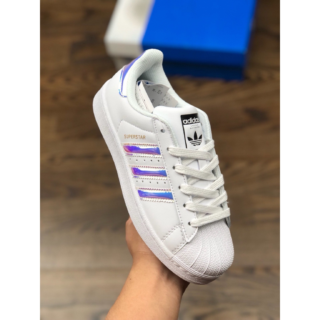 purple and white adidas shoes