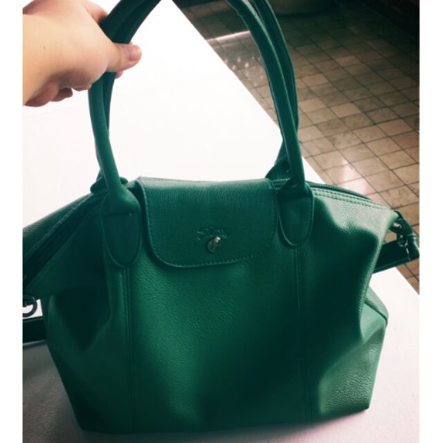 green leather purse